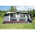 Swedish Tent Residence awning in light gray with red decorative stripe and white curtains.