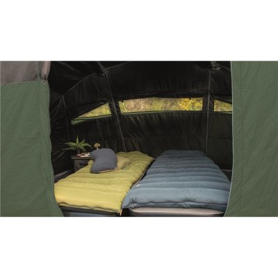 Dark sleeping cabin with a wall between the bedrooms that can be removed to get a large bedroom that accommodates the whole fami