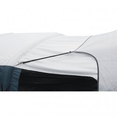 The extension is attached to the tent against the poles or the built-in attachment points on the air tubes.