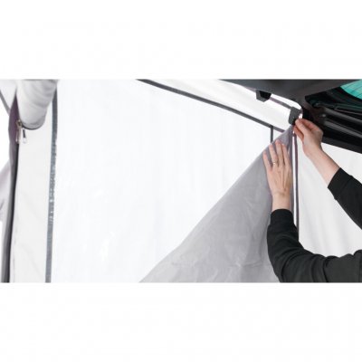 The tent has curtains on both windows.