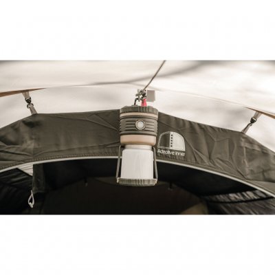 Hang a lantern on the ceiling of the tent.