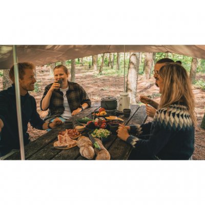 The tarp can also be erected over an ordinary fixed camping table.