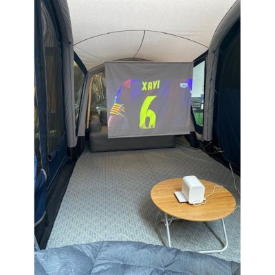 Create a cozy atmosphere in the tent and enjoy a movie together.