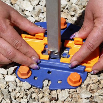 Press the lock to secure the plate to the legs of the awning.