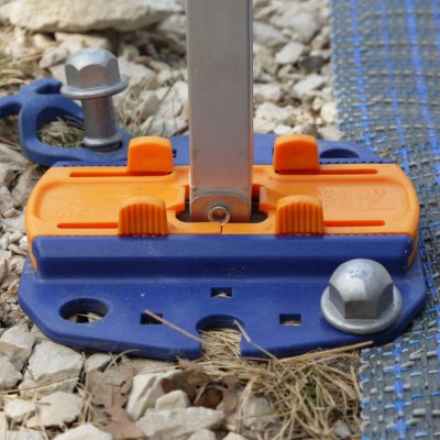 The attachment plate for awning legs mounted with ground pegs.
