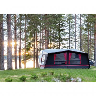 Swedish Tent Residence awning with red decorative stripe and red curtains.